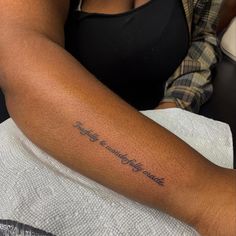 a woman with a tattoo on her arm that says, today is wonderfully made