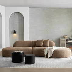 a living room filled with furniture and a rug on top of a hard wood floor