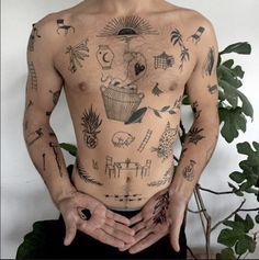 a man with many tattoos on his body