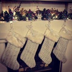 three christmas stockings hanging from a mantel