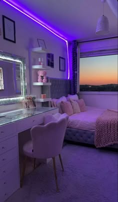 a bedroom with purple lighting and a bed