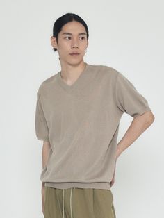 Editor's NoteANALOGMOOD's Linen Semi V Neckline Knit T-shirt is made out of acrylic and linen blend knit fabric that has a high air permeability. With a cool and soft touch, you can easily wear it during the summer season. With a wide variety of color choice and minimal design, it is versatile. You can layer or style it with various items for casual and relaxed look on the hot summer day. - High air and vapor permeability- V shaped neckline- Ribbed neckline and cuff- Loose silhouetteMeasurements (in.)M/L- Length: 27.17 in / 27.56 in- Chest: 21.65 in / 22.44 in- Shoulder: 18.90 in / 19.69 in- Sleeve: 9.06 in / 9.45 in* Model info: Height - 6', Waist - 32, Wearing size LComposition & Care- Acrylic 80% Linen 20%- Refer to care labelDesigner- by ANALOGMOOD Shirt Concept, Dark Beige, Ribbed Neckline, Knitted Tshirt, Summer Day, Minimal Design, Summer Season, V Shape, Hot Summer