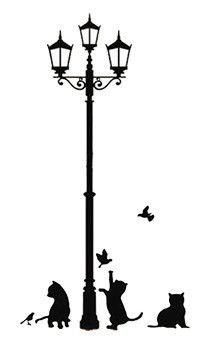 two cats sitting on the ground under a lamp post with birds flying around it and one cat looking up