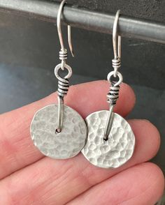 .935 Sterling silver hammered disk earrings. This is a great pair of sterling silver earrings! They have a wonderful hand forged artisan vibe--each hammer mark is visible and adds to the beauty. You will find yourself reaching for these earrings time after time. These earrings are made to order.  Because they are completely hand fabricated, each pair will be unique and have slight variations.  That's the magic of handmade! Please ask any questions before purchasing. Completely hand fabricated by me in my home studio **NOTE: Please allow two weeks fabrication time as these earrings are made to order. Sterling Earrings Handmade, Disk Earrings, Time After Time, Disc Earrings, Hammered Silver, Hand Forged, Sterling Earrings, Earrings Handmade, My Home