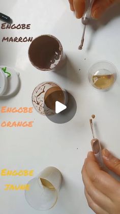 someone is painting their own chocolates on a white board with different colors and shapes