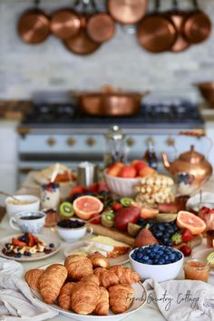 an assortment of food on a table in a kitchen