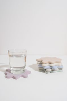 a glass of water and some cookies on a table