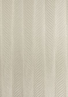 an upholstered white fabric with wavy lines