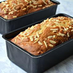 two loafs of bread with nuts in them