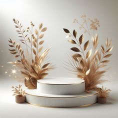 three white pedestals with gold leaves on them