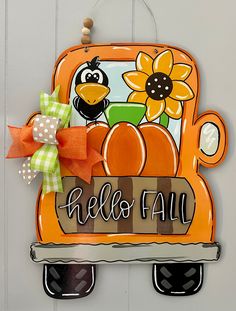 a door hanger that says hello fall with a bird and sunflower on it