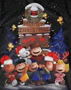 the peanuts gang in front of a merry christmas sign