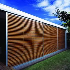 a house with wooden slats on the side