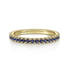 A sophisticated stackable ring featuring a sleek straight silhouette and numerous stunning blue sapphires. Crafted with rich gold and vibrant blue sapphires, this September birthstone ring is the perfect statement piece for any outfit. With its sleek design and numerous stones, it exudes elegance and sophistication. Available in 14K or 18K white, rose or yellow gold, platinum, and palladium Includes ring box Includes jewelry appraisal Ships fully insured to point of delivery All rings are fully customizable by Gabriel should you prefer slight or major changes to the style you see. Alteration possibilities include alternate color gemstones, styling or metal preference.