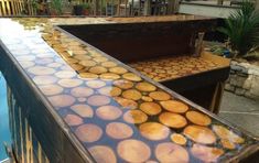 the reflection of trees in water is seen on the surface of an outdoor swimming pool