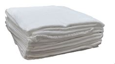 a stack of white towels stacked on top of each other in front of a white background