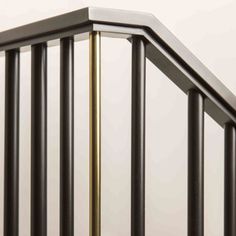 an image of a metal railing on a white wall