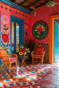 colorfully painted room with chairs and flowers in vases on tiled flooring area