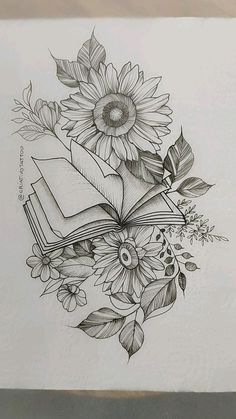 a drawing of a book with flowers and leaves on the cover, in black and white