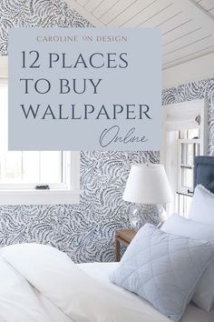 a bedroom with blue wallpaper and white bedding in the corner, text overlay reads 12 places to buy wallpaper online