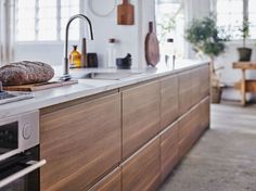 a loaf of bread sitting on top of a counter next to an oven and sink