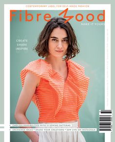 a woman in an orange top and white skirt posing for the camera with her hands on her hips