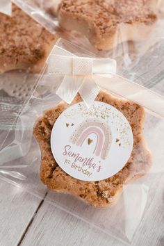 some kind of cookie sitting on top of a plastic bag with a ribbon around it