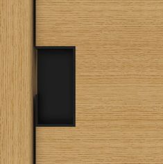 a wooden door with a black drawer in it