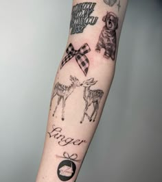 a person with a tattoo on their arm that has pictures of animals and words in it