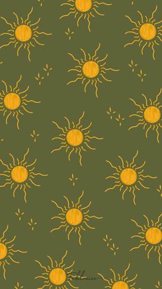 a green background with yellow sun designs on it