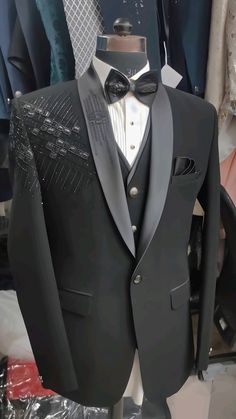 a black tuxedo and bow tie on display