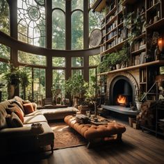 a living room filled with furniture and a fire place next to a large glass window