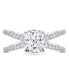 a cushion cut diamond ring with pave set shoulders