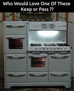 a white stove top oven sitting inside of a kitchen next to a wall with words above it