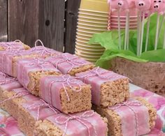 several pieces of cake sitting on top of a table