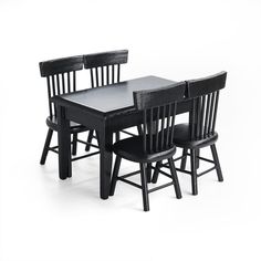 a black table and four chairs with one chair facing the other, in front of a white background