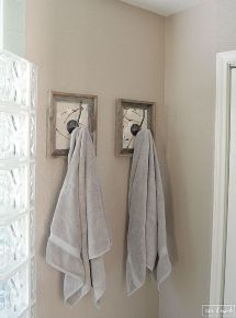 two towels hanging on the wall next to each other