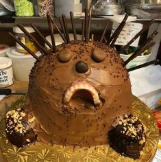 a cake shaped like a hedgehog with chocolate frosting and sprinkles