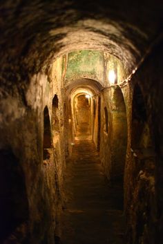 a narrow tunnel with light at the end