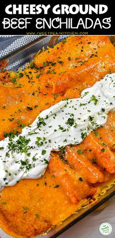 cheesy ground beef enchiladas in a casserole dish with sour cream on top