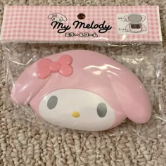 a hello kitty mouse with a pink bow on it's head in a package