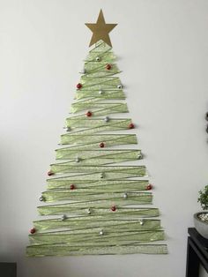 a christmas tree made out of strips of paper