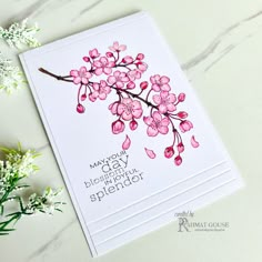 a close up of a card with flowers on it