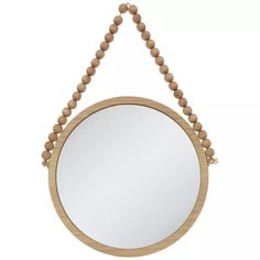 a wooden beaded mirror hanging on the wall