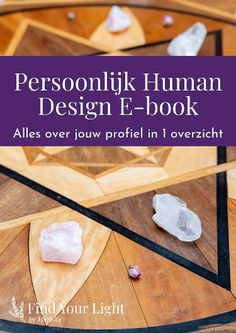 a wooden table topped with white rocks on top of it's sides and the words, personlik human design e - book