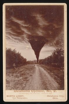 an image of a large tornado coming out of the sky over a dirt road with people walking on it