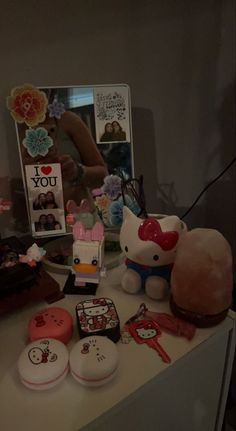 there are many different items on the counter top, including hello kitty and other things