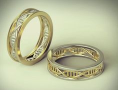 two gold wedding rings with intricate designs on each one, set against a white background