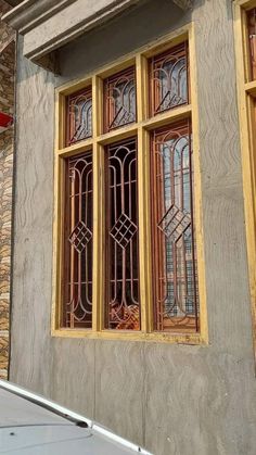 a car parked in front of a building with stained glass windows