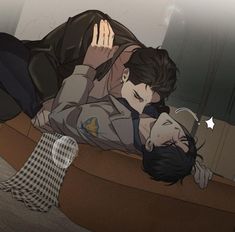 two people are laying on the floor with their heads touching each other's shoulders